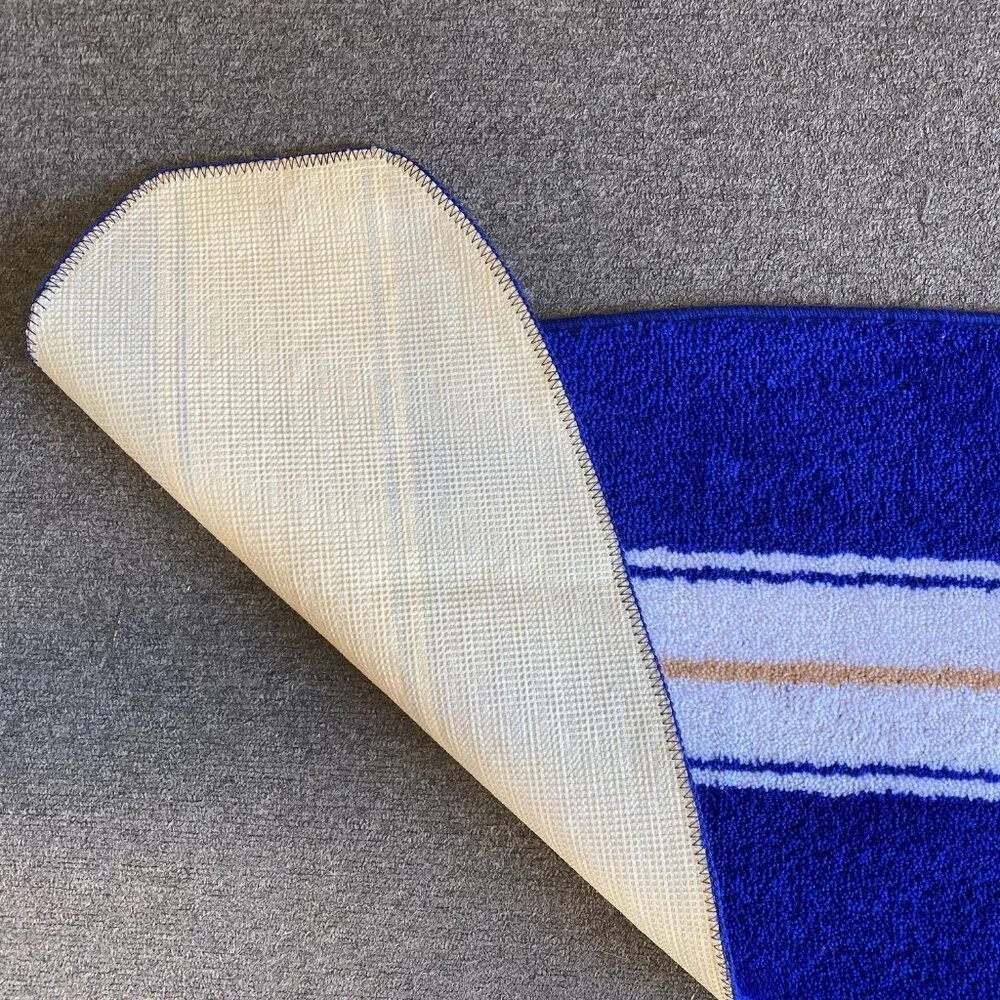 Blue and white surfboard shaped rug bath mat